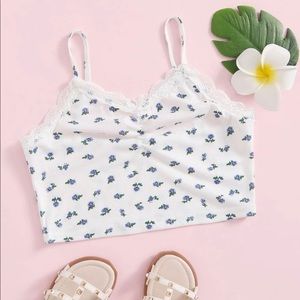 White crop top with blue flowers.